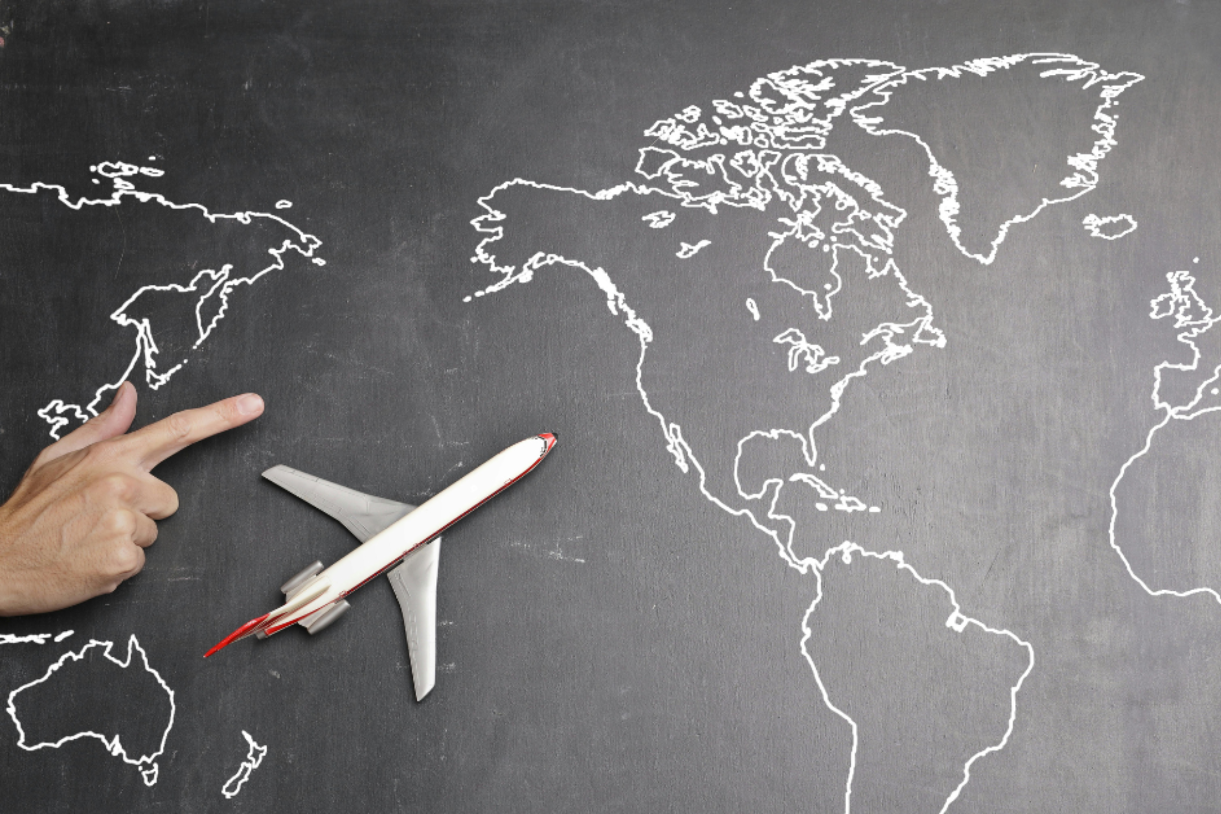 Map on a blackboard with a toy plane